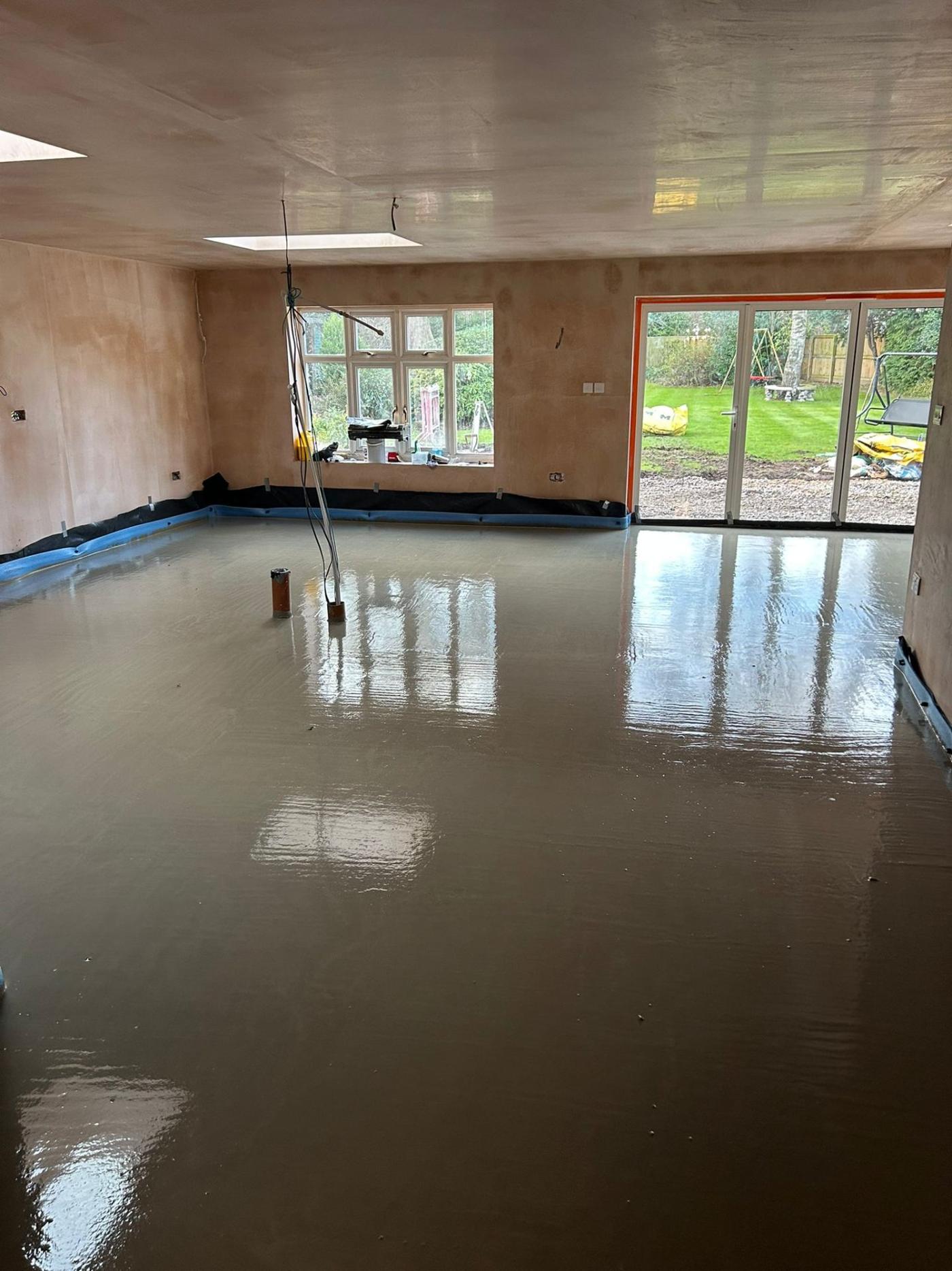 New-build home floor with freshly poured liquid screed